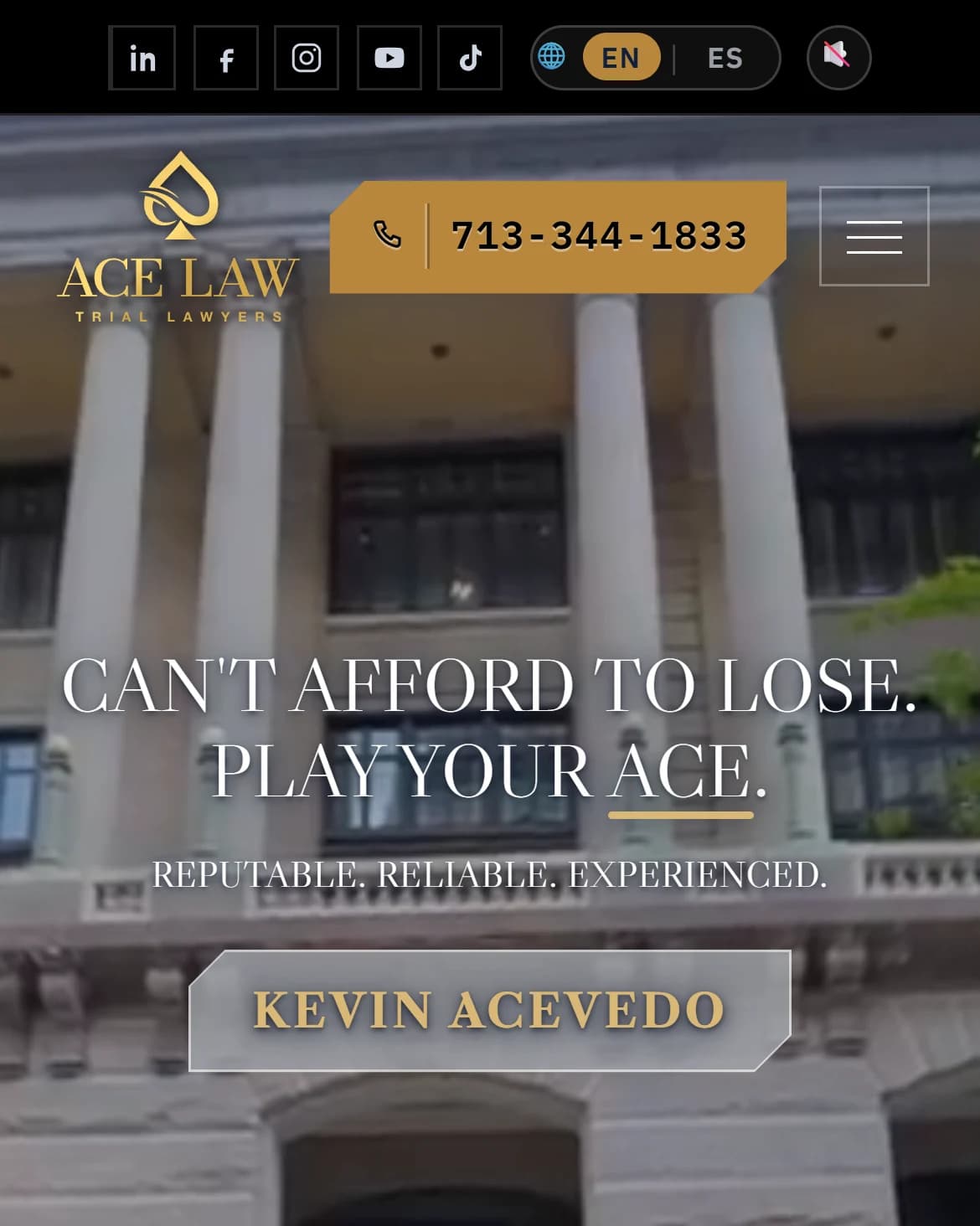 Law firm website homepage on a phone: language switch, logo and phone button above a headline, over a courthouse facade